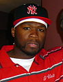 Durags, snapbacks and polo shirts were popular in the 2000s as men's wear, shown here by rapper 50 Cent in 2006