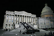 Honor guards carry the casket of former President Gerald R. Ford up the East Steps of the United States Capitol Building, Saturday evening, Dec. 30, 2006 in Washington, D.C.