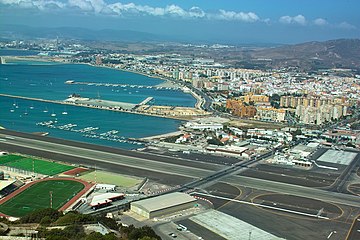 Gibraltar International Airport's runway 09/27, used to be crossed by the one road between Gibraltar and Spain.