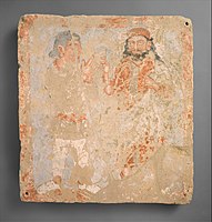 Kushan worshiper with deity Zeus/ Serapis/ Ohrmazd, Bactria, 3rd century AD.[63]