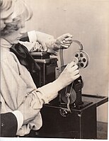 Triple-column film being threaded through the Home Projecting Kinetoscope, 1912