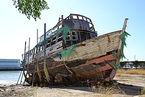 The same ferry, as a dilapidated shell, sitting on a boatramp