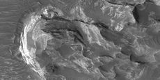 Close view of layers and light-toned material, as seen by HiRISE