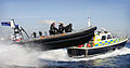 An Arctic 24 Rigid Hulled Inflatable Boat (RHIB) and the police launch 'Sir Evan Gibb', both of the Gibraltar Defence Police Marine Unit are pictured at speed in the Bay of Gibraltar.