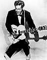 Image 5The 1950s were the true birth of the rock and roll music genre, led by figures such as Chuck Berry (pictured), Elvis Presley, Buddy Holly, Jerry Lee Lewis and others. (from 1950s)