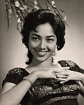 A black and white photograph of a woman