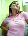 Image 90Woman wearing a polo shirt with a popped collar. (from 1990s in fashion)