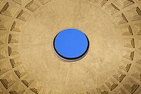 Close interior photo of the Pantheon's circular oculus opening at the center of the domed ceiling