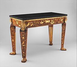Egyptian inspiration/Egyptian Revival: Table, 1775–1780, wood, carved, painted, and partly gilded, and black granite top not original to table, Metropolitan Museum of Art