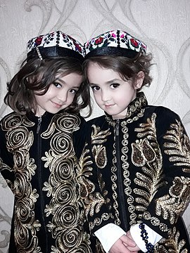 Uzbek children wearing an embroidered chopon known as a zarchopon