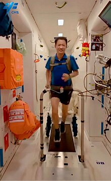 Astronaut Nie Haisheng doing running exercise on Tiangong Space Station