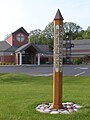 Peace pole at a church in Valparaiso, Indiana. Displays the Japanese text rotated, not arranged vertically.