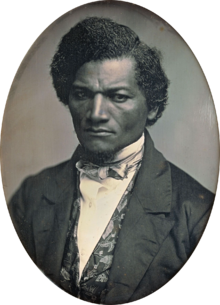 A photo of Douglass dressed in a suit