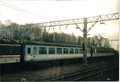 A picture of the blue NWSE Mk2 and grey and white Intercity Mk1 carnages in Crewe Goods yard during 2001.