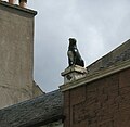 The "Girnin Dug" statue of a dog erected as a reproach to a neighbour suspected of poisoning the pet[33]