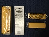 Government cheese from 2023: a large chunk of American pasteurized process cheese and a small chunk of processed Cheddar cheese