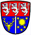 an endorse—Per fess gules and azure; in chief three lions rampant, argent, in base an endorse argent between, dexter, a stag's head cabossed, and, sinister, a sun in its splendour, between five mullets, or—Ross and Cromarty District Council, `Scotland