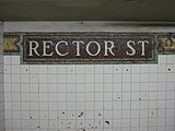 Remaining part of the original tiles and mosaics on the uptown platform