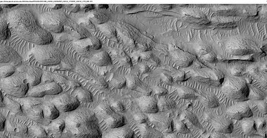 Layers and a field of small mounds Medusae Fossae Formation, as seen by HiRISE under HiWish program. Location is east of Gale Crater in the Aeolis quadrangle.