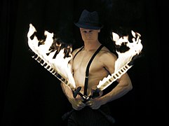 Performer with fire swords.