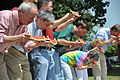 Governor Asa Hutchinson (left) and US Representative Mike Ross (second from left), competes in the annual watermelon eating competition in Hope