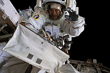 Jessica Meir waving at the camera during her EVA on October 18