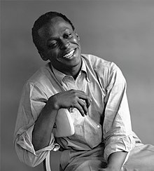 Miles Davis smiling for a portrait