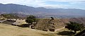Unrestored section of Monte Albán with Oaxaca City in the background