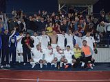 Serbian White Eagles FC players and fans celebrate victory