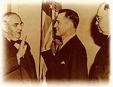 Stennis being sworn into the U.S. Senate by Arthur Vandenburg, 1947. James Eastland, Mississippi's other Senator, stands behind Stennis.