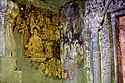The most intact painting in Cave 6: Buddha seated in dharma-chakra-mudra[148]