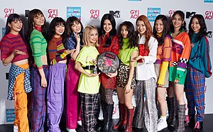 E-girls at the 2018 MTV Video Music Awards Japan From left to right: Anna Suda, Harumi Sato, Nonoka Yamaguchi, Reina Washio, Yurino, Karen Fujii, Sayaka, Yuzuna Takebe, Anna Ishii, Kaede, Nozomi Bando