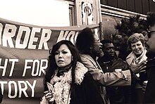 Mirikitani next to Cecil Williams at a protest in San Francisco, California in 1977. City supervisor Dorothy von Beroldingen is at right.