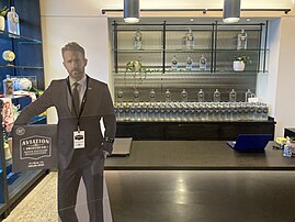 Welcome desk at distillery, with cutout of Ryan Reynolds