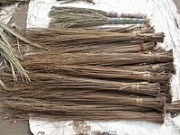 A hard-broom (walís-tingtíng) stall in the Philippines. Philippine hard brooms are often made from the hard primary veins of the leaves of the coconut palm frond.
