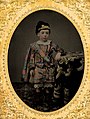 Boy with elaborately hand-tinted tartan clothing, c. 1860
