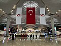 100th-anniversary banners and Turkish flags at Istanbul Airport
