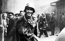 Witold Kieżun caught on documentary footage during the Warsaw uprising, 23 August, with a ceased HMG after a successful assault