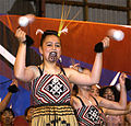 Maori poi performance in traditional dress