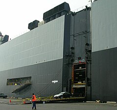 A pure car carrier ship's starboard side showing side ramp