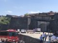 Shuri Castle's main gate and main hall's charred roof two days after the 2019 fire