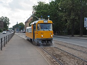 A specialised vehicle washing the tramway track in Riga, Latvia