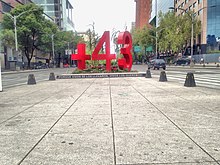 A giant sculpture that reads "Plus 43". Below, it is written in Spanish "Because they were taken alive, we want them back alive!"