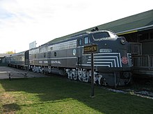 A diesel-engine train sitting at a station