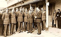 Faisal II with his uncle, Abd al-ilah, and other officers in the Iraqi army and behind them on the right appears Pasha Nuri al-Said