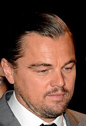 A photograph of Leonardo DiCaprio looking to his right