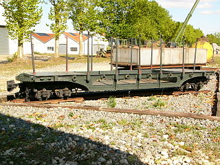 A pocket wagon for transporting artillery shells. A rectangular water tank wagon is in the background.