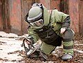 An EOD technician wearing a bomb suit