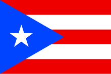 A red-and-white striped flag with a blue field on the far left that has a white star