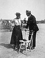 An image taken in 1912 depicting a man and woman wearing straw hats